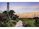 Lighthouse and walkway at sunset near beach at 10 Coral Creek Pl, Placida, FL 33946