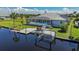 Waterfront home with private pool and dock, offering tranquil canal views at 15418 Alcove Cir, Port Charlotte, FL 33981