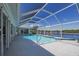 Refreshing pool area with screened enclosure and canal views at 15418 Alcove Cir, Port Charlotte, FL 33981