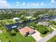 Spacious home on a canal with a private boat dock and lush landscaping in a well-established neighborhood at 15964 Viscount Cir, Port Charlotte, FL 33981