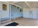 Covered patio with exterior door and access to laundry area at 740 Summersea Ct, Englewood, FL 34223