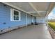 Covered patio with concrete flooring and exterior lighting at 740 Summersea Ct, Englewood, FL 34223