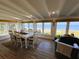 Bright dining room with ocean views and hardwood floors at 8160 Little Gasparilla Is, Placida, FL 33946