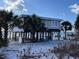 Elevated beach house with storm damage, requiring repairs at 8160 Little Gasparilla Is, Placida, FL 33946