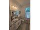 Bathroom with single sink, granite countertop, and shower/tub combo at 9174 Bensonhurst Ln, Englewood, FL 34224