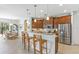 Bright kitchen boasts granite countertops, stainless steel appliances, and an island at 15964 Viscount Cir, Port Charlotte, FL 33981