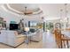 Open living room featuring a contemporary aesthetic, comfortable seating, and views of the backyard at 15964 Viscount Cir, Port Charlotte, FL 33981