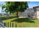 Landscaped backyard with fenced area and lush greenery at 15964 Viscount Cir, Port Charlotte, FL 33981