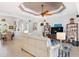 Spacious living room featuring a neutral color palette, comfortable seating, and built-in shelving at 15964 Viscount Cir, Port Charlotte, FL 33981