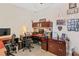 Bright home office features a large desk and two comfortable office chairs at 15964 Viscount Cir, Port Charlotte, FL 33981