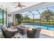 Spacious screened-in pool and patio with seating area at 15964 Viscount Cir, Port Charlotte, FL 33981
