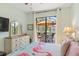 King bedroom with patio access and relaxing water views at 15964 Viscount Cir, Port Charlotte, FL 33981