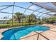 Enjoy this relaxing pool and patio area with water views at 15964 Viscount Cir, Port Charlotte, FL 33981