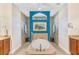 Elegant bathroom with a large soaking tub, walk-in shower, and dual vanities at 15964 Viscount Cir, Port Charlotte, FL 33981