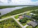 Aerial view of waterfront property with boat access at 15964 Viscount Cir, Port Charlotte, FL 33981