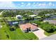 Aerial view showcasing the home's location on a canal at 15964 Viscount Cir, Port Charlotte, FL 33981