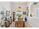 Spacious dining room with hardwood table, chandelier, and views to backyard at 15964 Viscount Cir, Port Charlotte, FL 33981