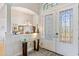 Bright entryway with double doors and stained glass inserts at 15964 Viscount Cir, Port Charlotte, FL 33981