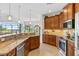 Spacious kitchen with granite counters, stainless steel appliances & wood cabinets at 15964 Viscount Cir, Port Charlotte, FL 33981