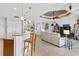 Open kitchen features granite countertops, stainless steel appliances, and custom wood cabinetry at 15964 Viscount Cir, Port Charlotte, FL 33981