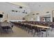 Spacious community room with stage and numerous tables at 740 Summersea Ct, Englewood, FL 34223