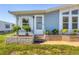 Front entrance with steps and landscaping at 740 Summersea Ct, Englewood, FL 34223