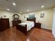 Spacious bedroom with wood flooring and a dresser at 192 Cougar Way, Rotonda West, FL 33947