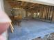 Unfinished garage interior with concrete floor and exposed framing at 2614 Oberon Rd, Englewood, FL 34224