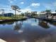 Waterfront view of canal with boats and houses at 2614 Oberon Rd, Englewood, FL 34224