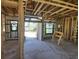 Interior framing of a house under construction with large windows at 2614 Oberon Rd, Englewood, FL 34224