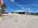 House under construction, showing the exterior walls and roof at 2614 Oberon Rd, Englewood, FL 34224