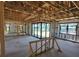 Interior framing of a house under construction with large windows at 2614 Oberon Rd, Englewood, FL 34224