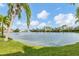 Serene lakefront property with lush landscaping at 150 L Pavia Blvd # 14, Venice, FL 34292