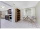 Compact dining area next to a bookshelf and kitchen at 301 W Fray St, Englewood, FL 34223