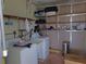Laundry room with washer, dryer, and ample shelving at 6246 Parakeet Rd, Englewood, FL 34224