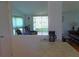 Kitchen with view into living room and screened porch at 6246 Parakeet Rd, Englewood, FL 34224