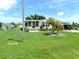 Single-wide home with a screened porch and spacious yard at 6246 Parakeet Rd, Englewood, FL 34224