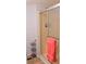 Bathroom with shower, linen rack, and tiled floor at 6246 Parakeet Rd, Englewood, FL 34224