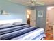 Main bedroom with king-size bed and view of dining area at 6246 Parakeet Rd, Englewood, FL 34224