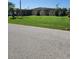 Ranch-style home with a well-maintained lawn at 1455 Crest Dr, Englewood, FL 34223