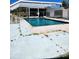 Inviting swimming pool with a covered patio area at 1455 Crest Dr, Englewood, FL 34223