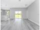 Open living room with access to kitchen and backyard at 213 Antis Dr, Rotonda West, FL 33947