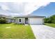 Charming one-story home with a two-car garage at 213 Antis Dr, Rotonda West, FL 33947