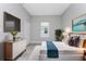 Main bedroom with large bed, dresser, and window at 213 Antis Dr, Rotonda West, FL 33947