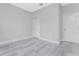 Spacious bedroom with gray walls and wood-look flooring at 213 Antis Dr, Rotonda West, FL 33947