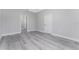 Spacious bedroom featuring grey vinyl flooring and access to other rooms at 213 Antis Dr, Rotonda West, FL 33947