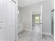 Bathroom with white cabinets, grey flooring, and an ensuite bath at 213 Antis Dr, Rotonda West, FL 33947