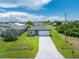 New construction home with paved driveway at 213 Antis Dr, Rotonda West, FL 33947