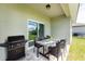 Covered patio with table, chairs, and built-in grill at 213 Antis Dr, Rotonda West, FL 33947