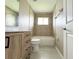 Bright bathroom featuring a bathtub and a classic vanity with ample storage at 35 Mark Twain Ln, Rotonda West, FL 33947